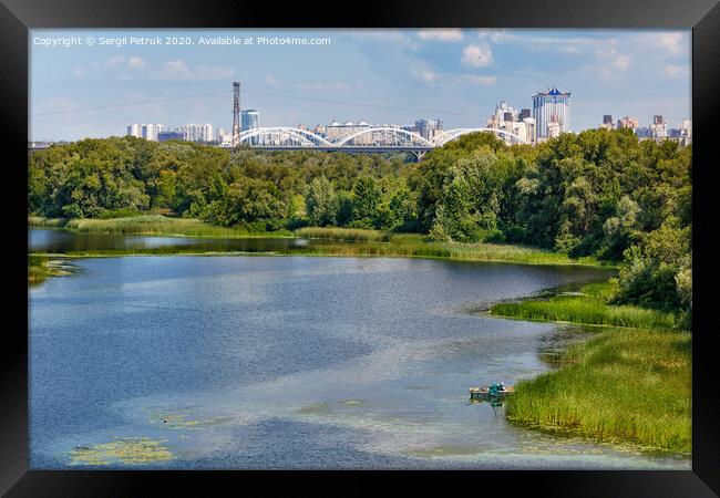 Natural picturesque landscape of the Dnipro bay near one of the river islands. An industrial city is visible in the background. Framed Print by Sergii Petruk