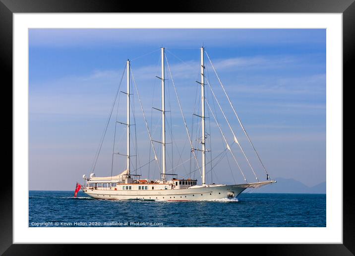 Motor yacht under way Framed Mounted Print by Kevin Hellon