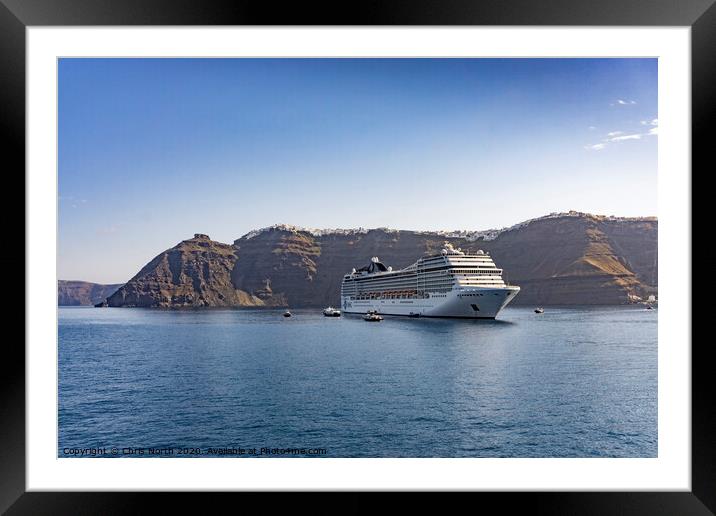 Cruise liner at anchor in Santorini Bay. Framed Mounted Print by Chris North