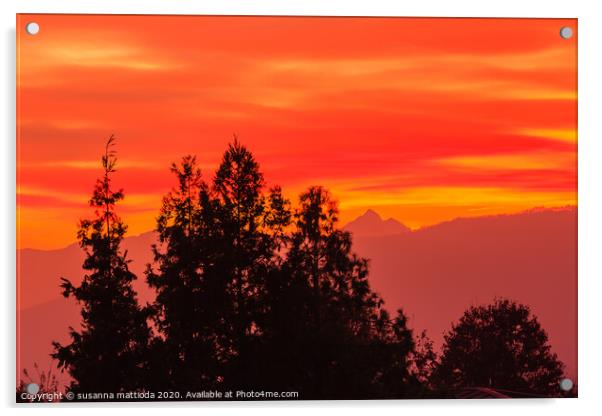 a spectacular sunset over the mountains paints the Acrylic by susanna mattioda