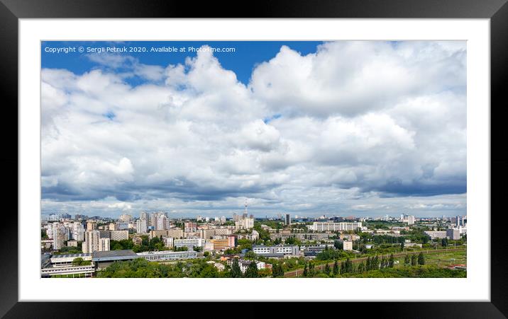 Panorama of Kyiv, with high cloudy skies over residential areas, green parks and a TV tower. Framed Mounted Print by Sergii Petruk