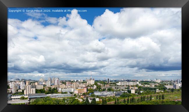 Panorama of Kyiv, with high cloudy skies over residential areas, green parks and a TV tower. Framed Print by Sergii Petruk