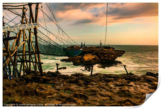 Rock island connected by rope foot bridge Print by Hanif Setiawan