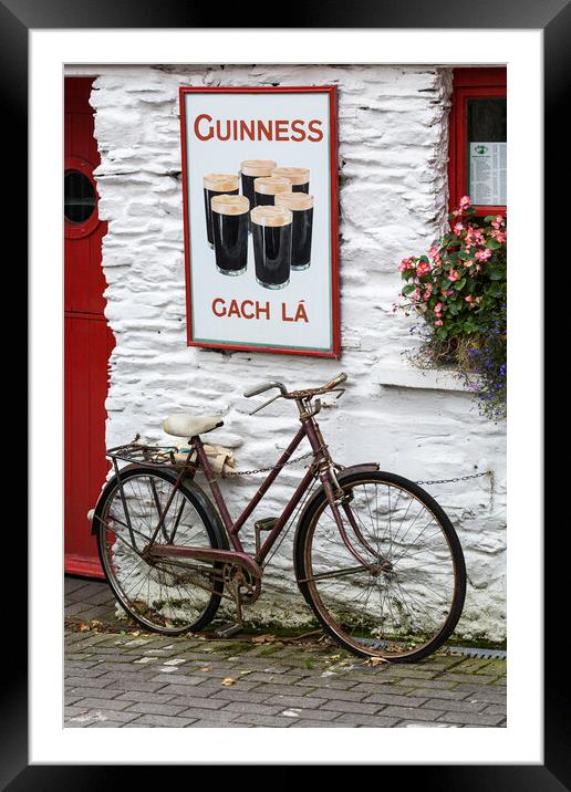 Old Guinness ad and Bicycle, West Cork, Ireland Framed Mounted Print by Phil Crean