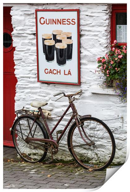 Old Guinness ad and Bicycle, West Cork, Ireland Print by Phil Crean