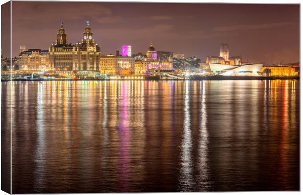 Liverpool waterfront at night and lighting on the River Mersey Canvas Print by Dave Wood