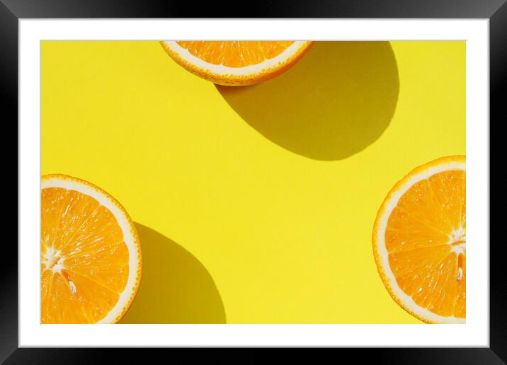 Oranges on yellow background Framed Mounted Print by Tartalja 