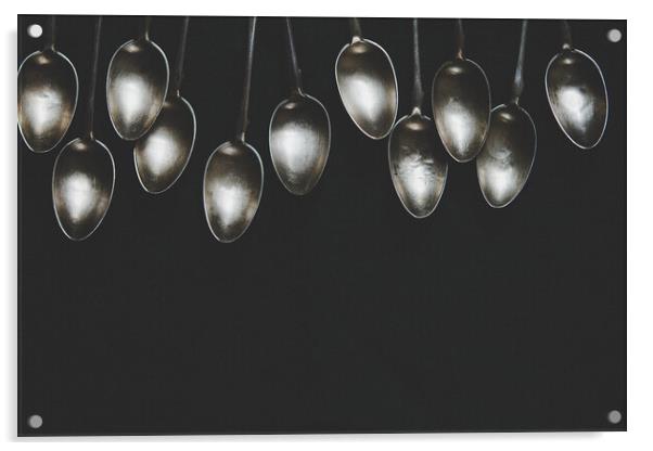A row of silver tea spoons laying on canvas cloth, background Acrylic by Tartalja 