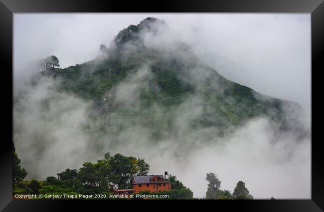 A lonely house and playing clouds Framed Print by Sanjeev Thapa Magar