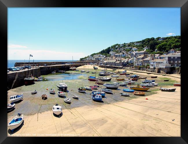 Mousehole harbour at low tide in Cornwall. Framed Print by john hill