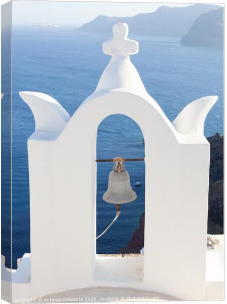 White bell tower at Oia, Santorini, Greece. Canvas Print by Antonio Gravante