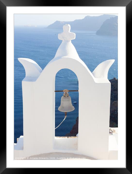 White bell tower at Oia, Santorini, Greece. Framed Mounted Print by Antonio Gravante