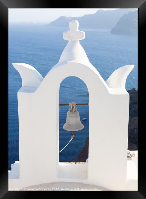White bell tower at Oia, Santorini, Greece. Framed Print by Antonio Gravante