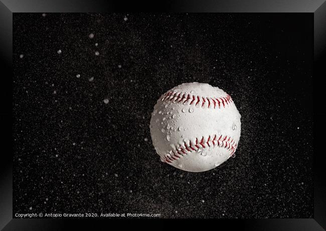 Baseball ball flying in the rain. Framed Print by Antonio Gravante