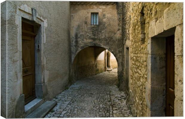 Medieval Alley in Banon, Provence Canvas Print by Arterra 