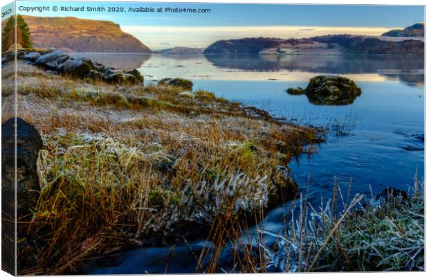 A wee burn flows into Loch Portree on the high tide. Canvas Print by Richard Smith