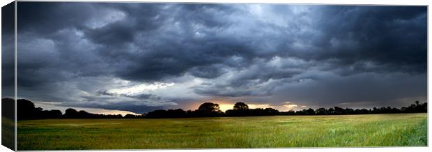 Stormy Sunset Canvas Print by Paul Macro