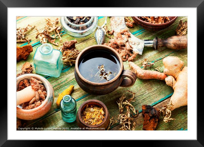 Herbal tea on old wooden table Framed Mounted Print by Mykola Lunov Mykola