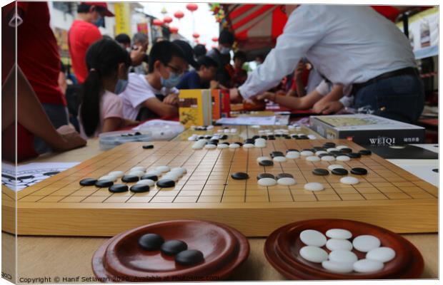 Chinese playing Go Game, Weiqi in a street. Canvas Print by Hanif Setiawan
