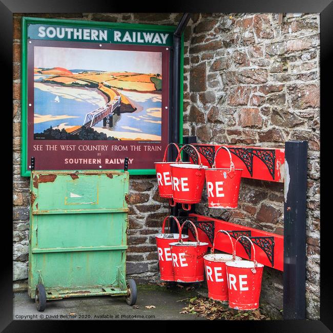 Fire bucket at Southern railway station Framed Print by David Belcher