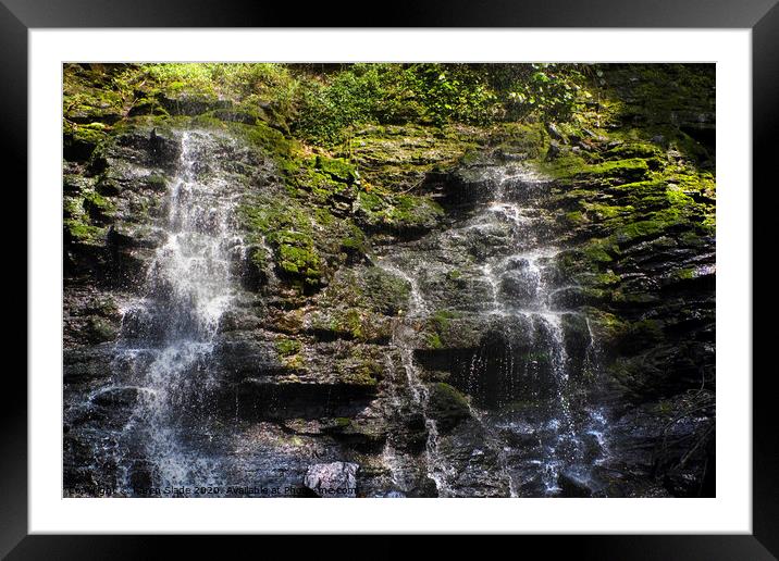 A double waterfall gently cascading over Ghanaian rocks and greenery Framed Mounted Print by Karen Slade