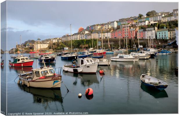 Colourful boats and houses at Brixham Harbour Canvas Print by Rosie Spooner