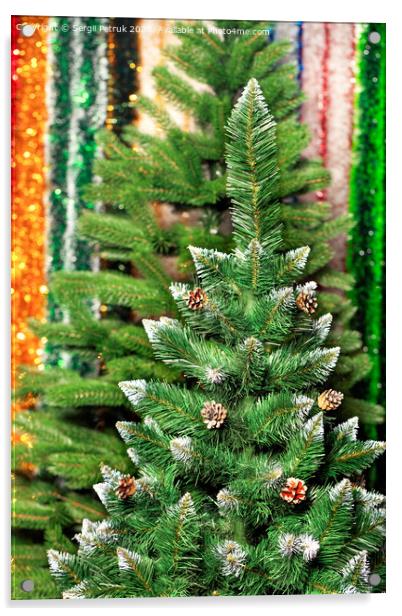 Artificial Christmas pine on a background of multicolored tinsel in blur. Acrylic by Sergii Petruk