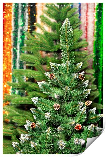 Artificial Christmas pine on a background of multicolored tinsel in blur. Print by Sergii Petruk