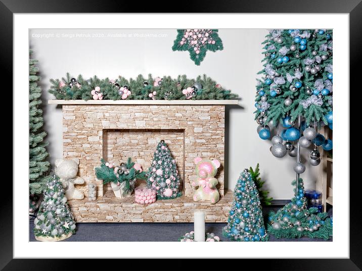 New Years holiday, fireplace with gifts, decorative Christmas trees, toys, balls and fir branches. Framed Mounted Print by Sergii Petruk