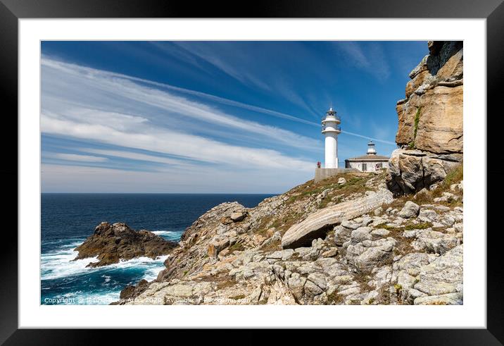 Lighthouse and rocks Framed Mounted Print by Jesus Portas Arias