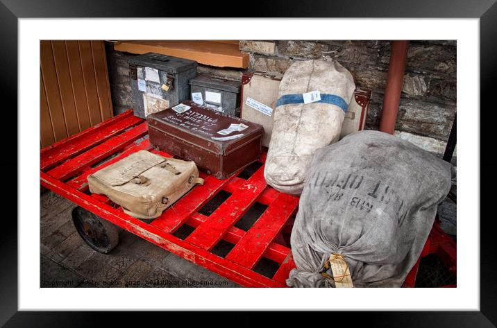 Trolley with vintage luggage items at Buckfastleigh Station, Devon, UK Framed Mounted Print by Peter Bolton