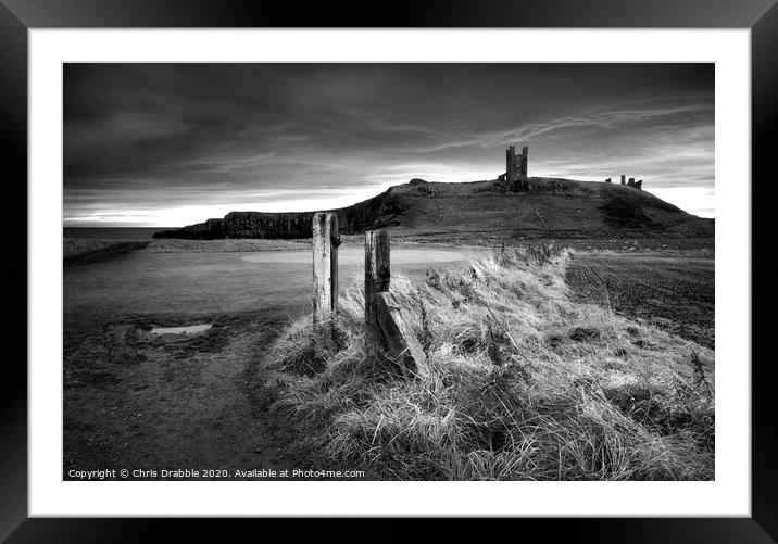 Dunstanburgh Castle in mono (5) Framed Mounted Print by Chris Drabble