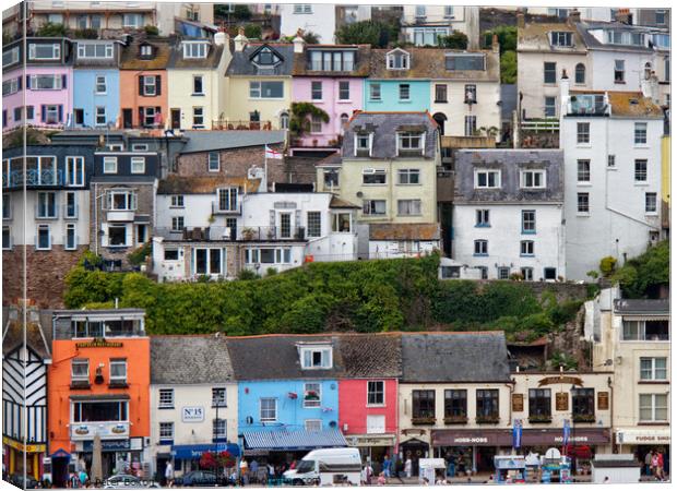 Detail of some of the colourful houses surrounding the harbour in Brixham, Devon, UK. Canvas Print by Peter Bolton