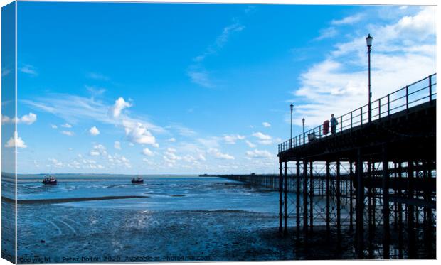 Looking along Southend Pier from the shore towards the pier head. Southend on Sea, Essex, UK.  Canvas Print by Peter Bolton