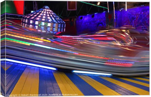 Fairground ride by night - long exposure Canvas Print by Robert MacDowall