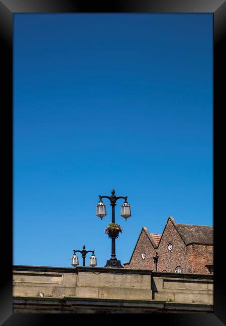 Street lamps against blue sky, York, Yorkshire,  Framed Print by Phil Crean