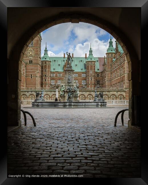 Entrance through a dark gate under an arch to Frederiksborg cast Framed Print by Stig Alenäs