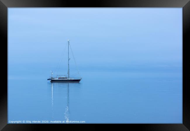 Lonely Black yacht in the ocean before sunrise Framed Print by Stig Alenäs
