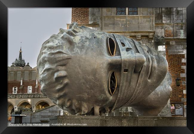Bronze head in the main square, old town Krakow Framed Print by Stig Alenäs