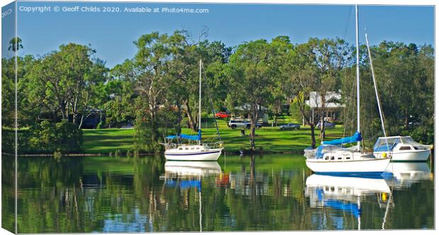 Yachts and green parkland, Lake Macquarie. Canvas Print by Geoff Childs