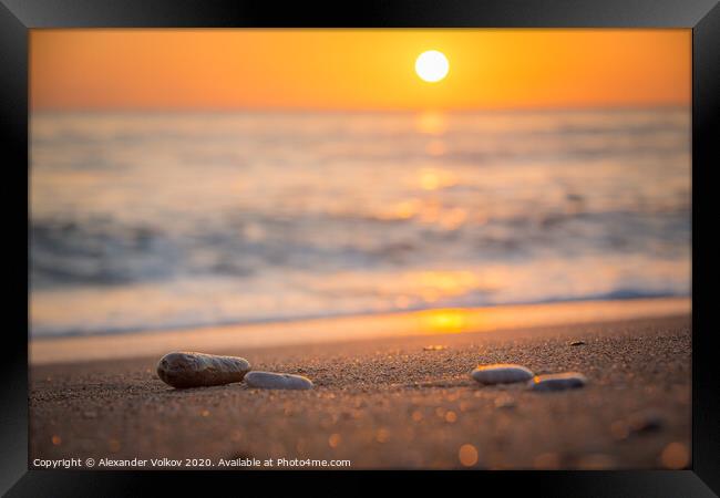 Orange sunset on a calm sea and sandy beach and ra Framed Print by Alexander Volkov