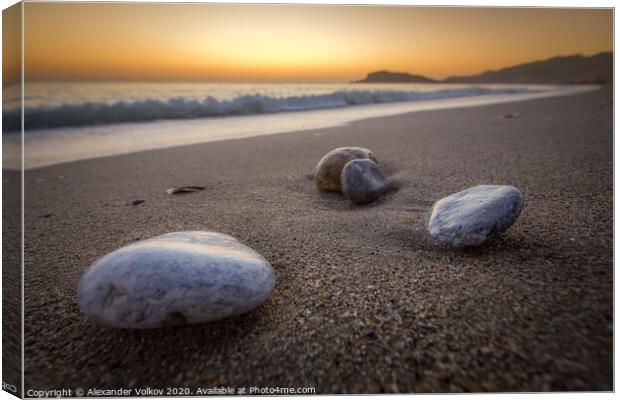 Sea-washed pebbles on a quiet sandy Mediterranean  Canvas Print by Alexander Volkov