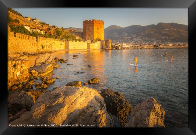 SUP surfers in the morning in the port of Alanya Framed Print by Alexander Volkov