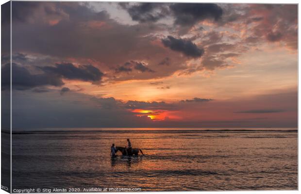 Woman riding a horse in shallow water at sunset  Canvas Print by Stig Alenäs