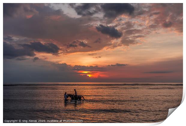 Woman riding a horse in shallow water at sunset  Print by Stig Alenäs