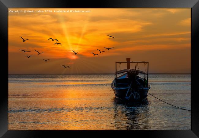 Boat facing the sunset in Pak Meng Framed Print by Kevin Hellon
