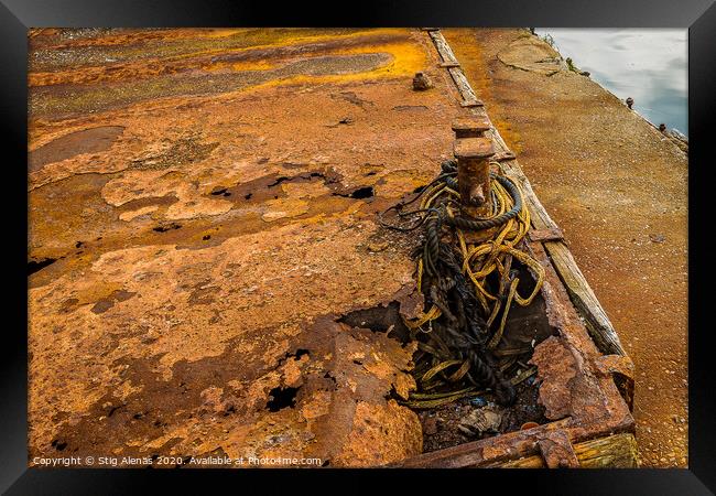 two very rusty bollards at the quay Framed Print by Stig Alenäs