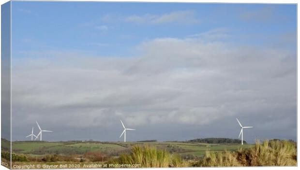 The windmills at Stormy as seen from Porthcawl  Canvas Print by Gaynor Ball