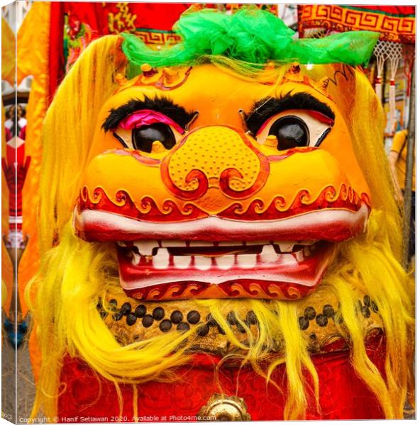 Golden red Chinese Dragon mask on a festival Canvas Print by Hanif Setiawan
