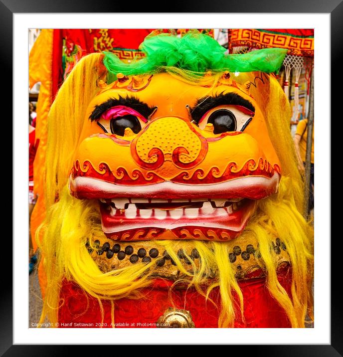 Golden red Chinese Dragon mask on a festival Framed Mounted Print by Hanif Setiawan